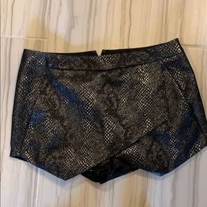 Express. Black snake skin metallic skort